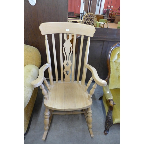 145 - A beech farmhouse rocking chair