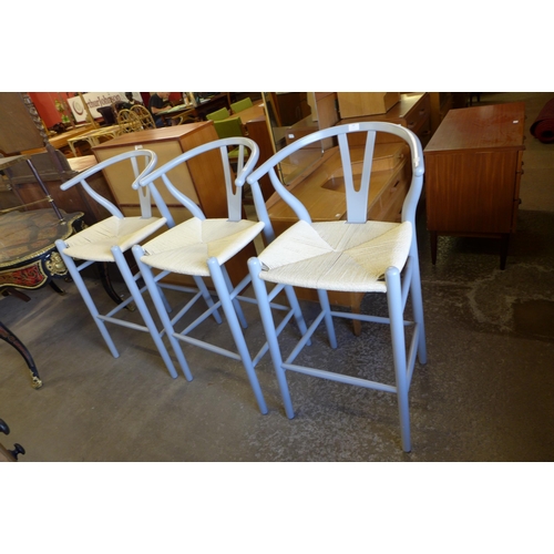 148 - A set of three Hans Wagner style painted beech stools