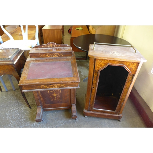 151 - A Victorian inlaid walnut Davenport and a music cabinet