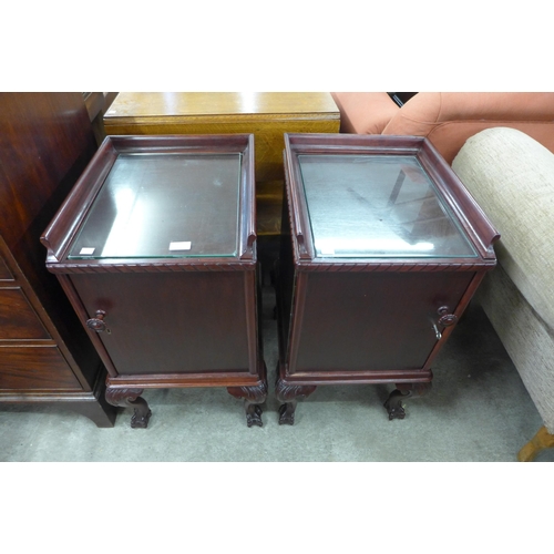 162 - A pair of Chippendale style mahogany pot cupboards