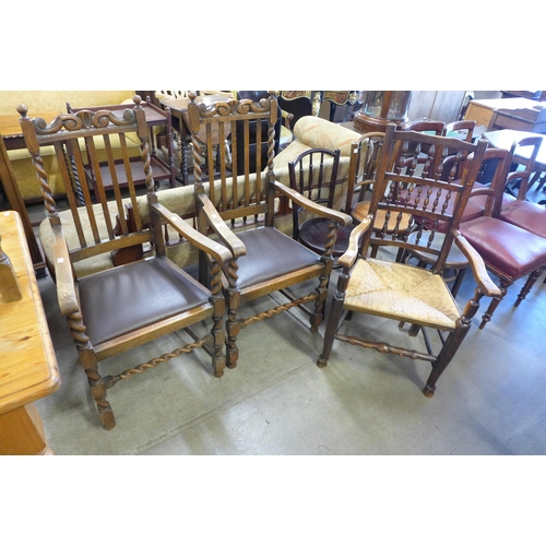 181 - A pair of early 20th Century oak barleytwist carver chairs and a George III style elm spindle back c... 