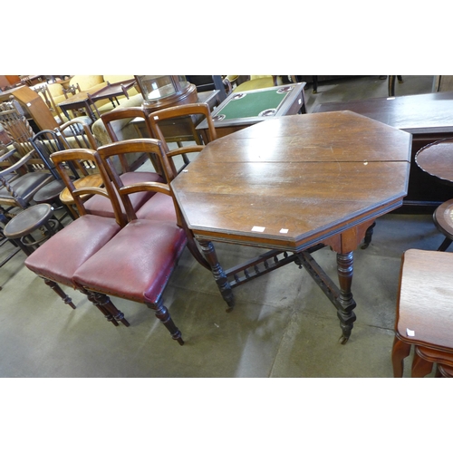 185 - A Victorian mahogany octagonal centre table and four dining chairs