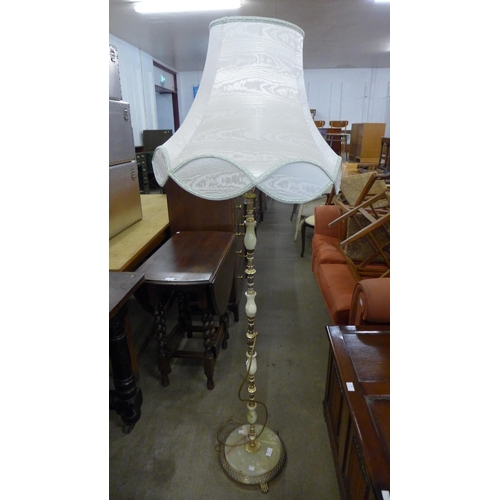 200 - A brass and onyx standard lamp