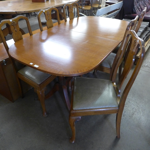 206 - An inlaid mahogany and walnut eight piece dining suite