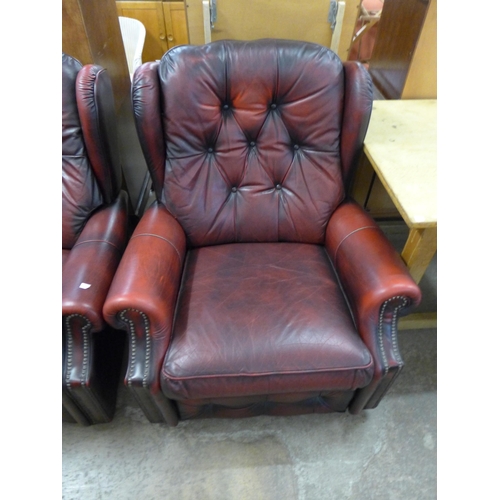 207 - A red leather buttoned sofa and armchair