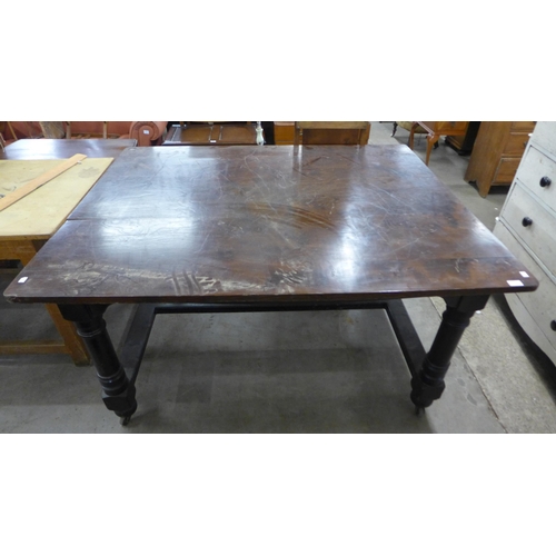 210 - A Victorian painted beech kitchen table with an elm top