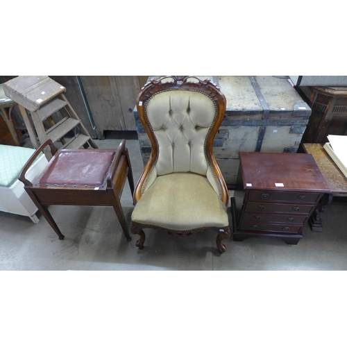 215 - A small mahogany chest of drawers, piano stool and a mahogany and upholstered bedroom chair