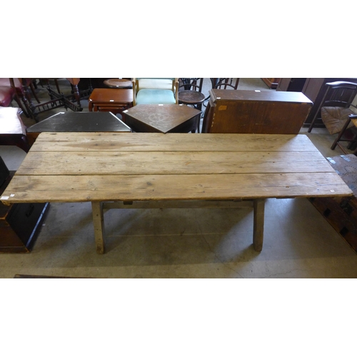 220 - A Gothic pine x-frame farmhouse refectory table