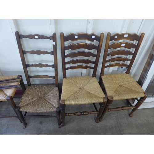 223 - Two Arts and Crafts beech chairs (one a/f), a stool and a pair of elm rush seated ladderback chairs