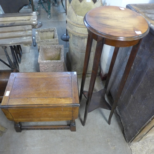 226 - An oak jardiniere stand and a small drop leaf table