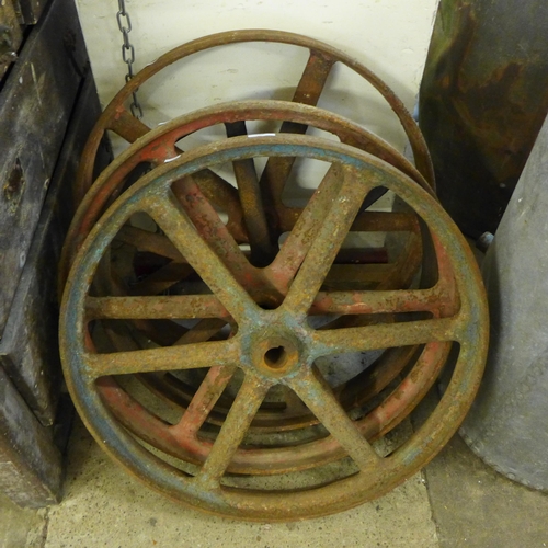 248 - Four vintage cast iron wheels