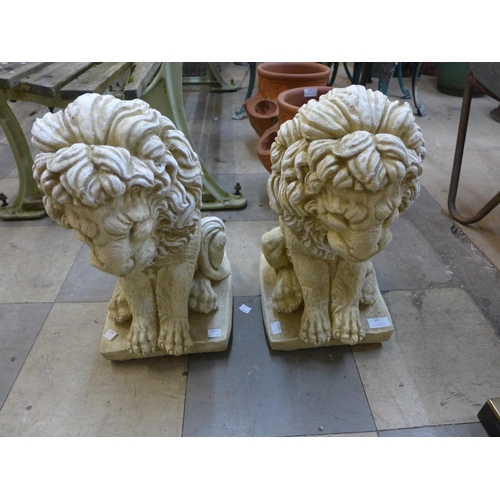 261 - A pair of concrete figural painted garden lions