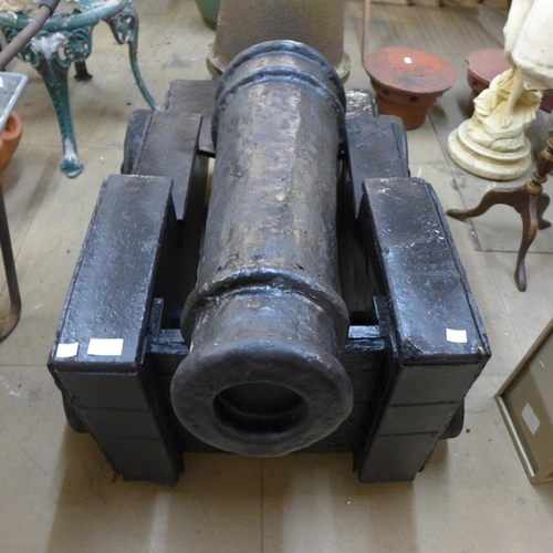 271 - A painted wooden and plaster of Paris cannon