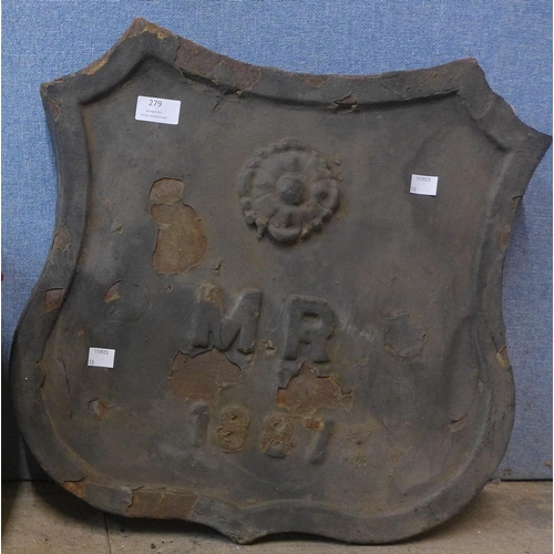 279 - A cast iron armorial plaque, dated 1887