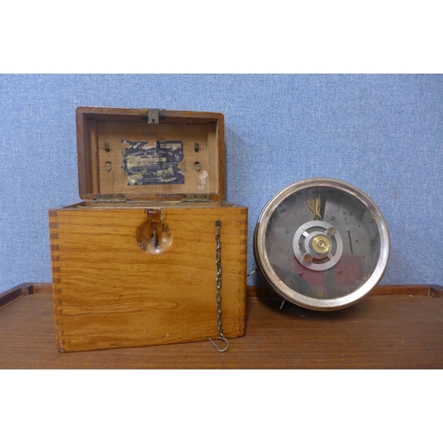 297 - A vintage cased pigeon racing clock