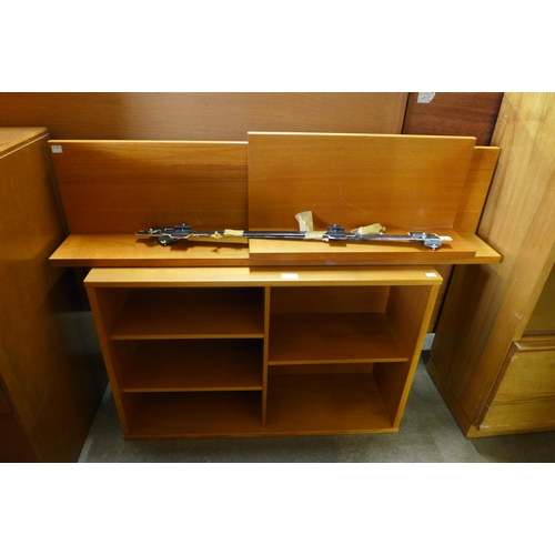 76 - A Tapley teak floating wall mounted cabinet