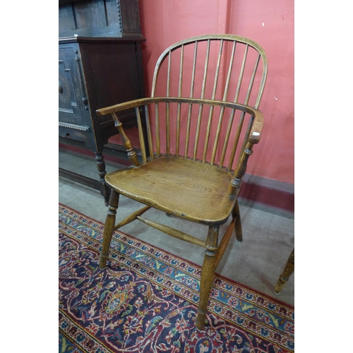 82 - A pair of Victorian elm Windsor armchairs