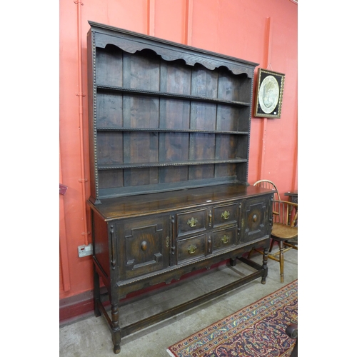 84 - A Jacobean Revival carved oak dresser