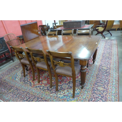 85 - A Victorian mahogany extending dining table and six Regency style chairs, table dimensions; 72cms h,... 