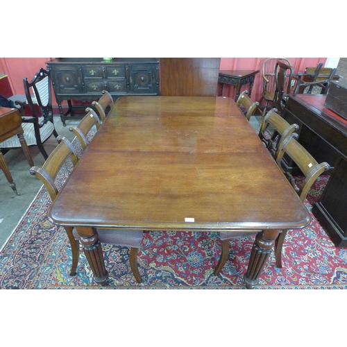 85 - A Victorian mahogany extending dining table and six Regency style chairs, table dimensions; 72cms h,... 