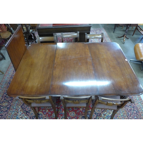 85 - A Victorian mahogany extending dining table and six Regency style chairs, table dimensions; 72cms h,... 