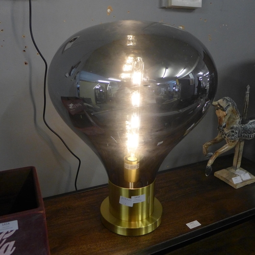 1410 - A brushed gold table lamp with smoked glass shade