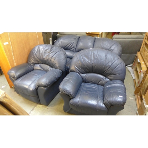 1701 - A blue leather three seater sofa, two armchairs and a footstool