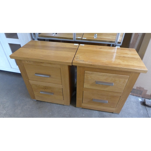 1702 - A pair of oak bedside chests, marked top