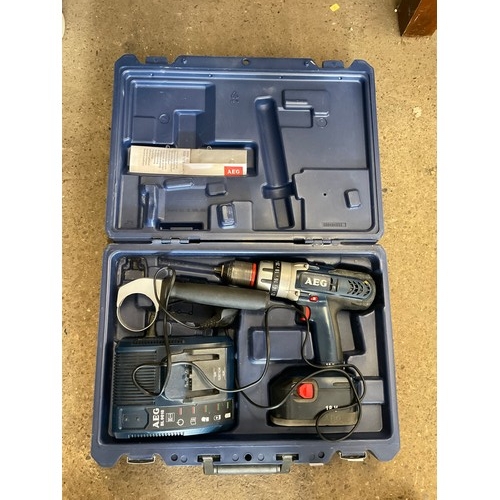 2106 - AEG 18V hammer drill with charger, in case