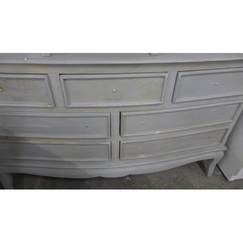 1473 - A grey washed rustic chest of seven drawers and a bedside chest * this lot is subject to VAT