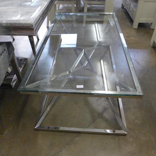 1557 - A chrome and glass coffee table * this lot is subject to VAT