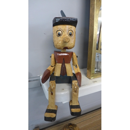 1495 - An articulated hand crafted wooden Pinocchio, H 35cms (AR01316)   #