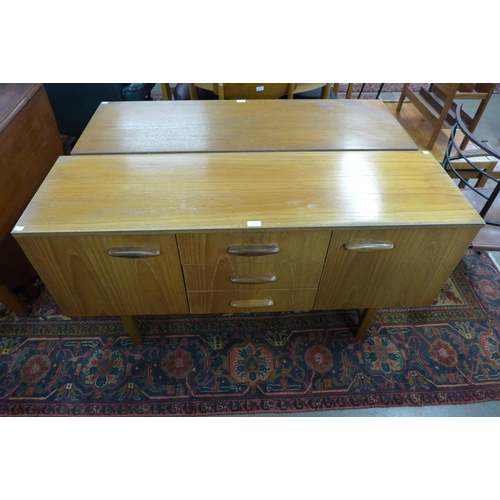 51 - A small teak sideboard