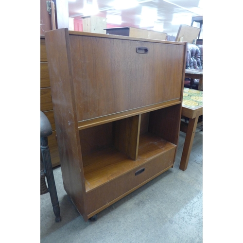 65 - A teak cocktail cabinet