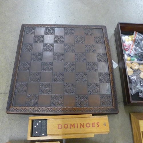 1043 - A collection of board games including chess sets, dominoes and playing cards