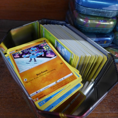 632 - A collection of 750 Pokemon cards in ten tins