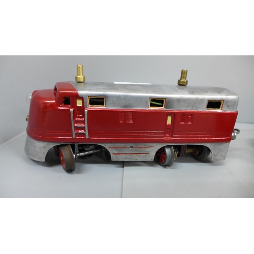 643 - A cast aluminium electric model diesel locomotive and two carriages