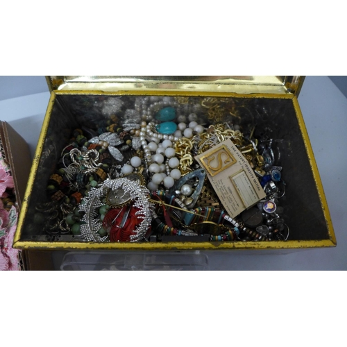 708 - A tin and box of costume jewellery