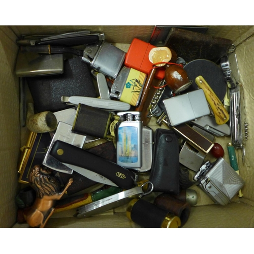 713 - A collection of lighters, pipes, pocket knives, etc.