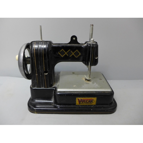 717 - A child's Vulcan toy sewing machine