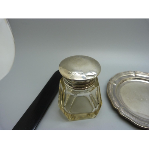 812 - A silver backed brush, a silver topped jar, top a/f, an ebony and applied silver mirror and letter o... 