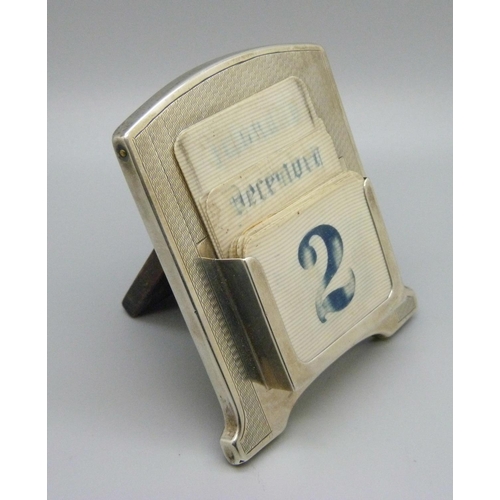 827 - A silver Art Deco perpetual calendar, Birmingham 1927, date cards worn, with three cardboard hand wr... 