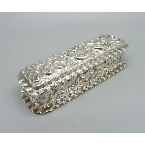 829 - An embossed silver box, Birmingham 1903, Jones & Crompton, 53g, 9cm wide