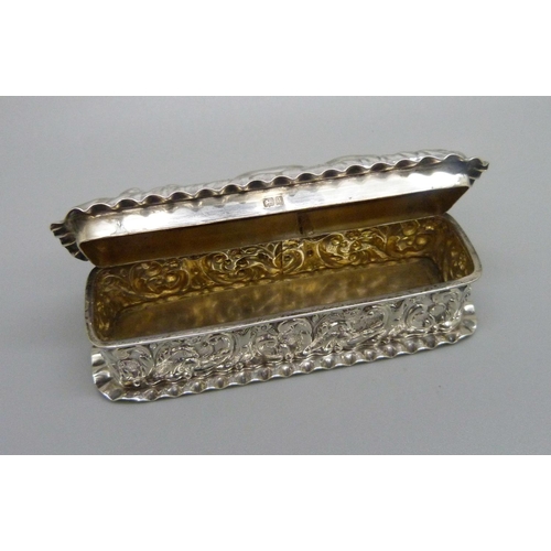 829 - An embossed silver box, Birmingham 1903, Jones & Crompton, 53g, 9cm wide