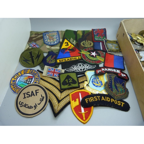 860 - Military badges, uniform patches, coins and buttons, etc.