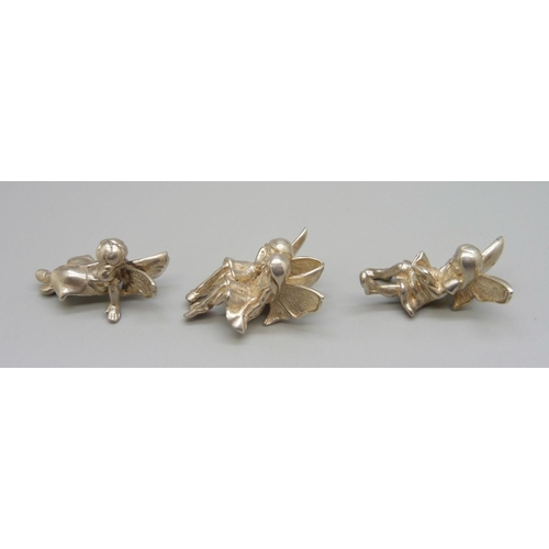 884 - Three silver shelf fairies, 83g