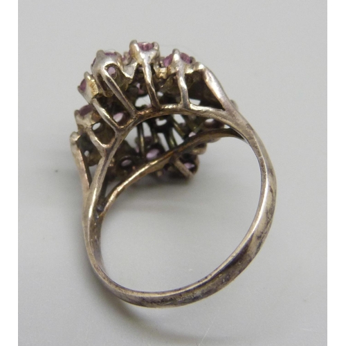 887 - A large silver and pink stone cluster ring, T