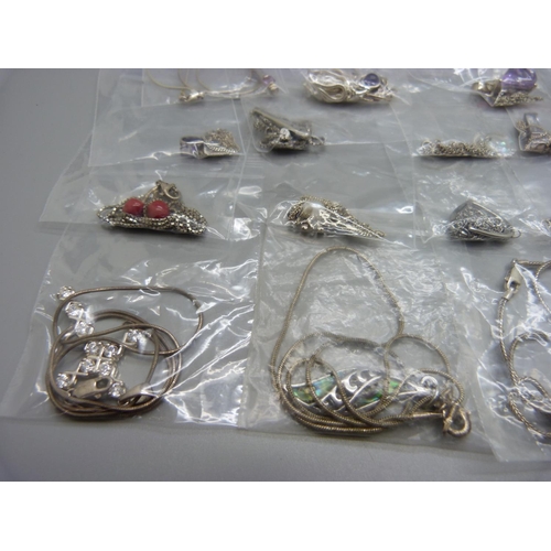 899 - Silver pendants and chains