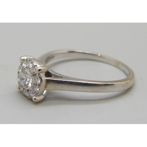 905 - An 18ct white gold brilliant cut diamond ring, 3.4g, O, colour EF, clarity VVS, eleven diamonds in t... 