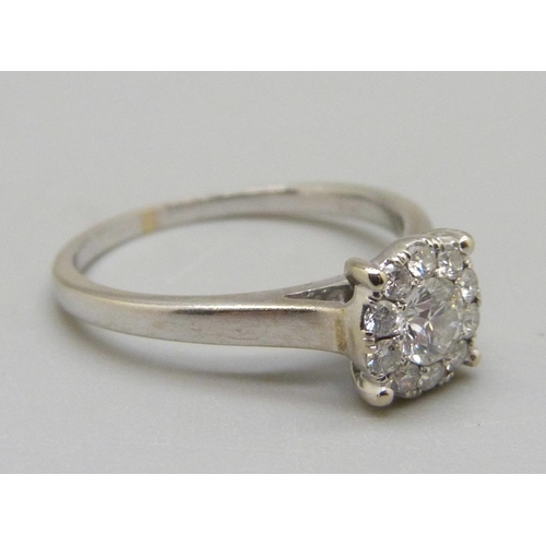 905 - An 18ct white gold brilliant cut diamond ring, 3.4g, O, colour EF, clarity VVS, eleven diamonds in t... 